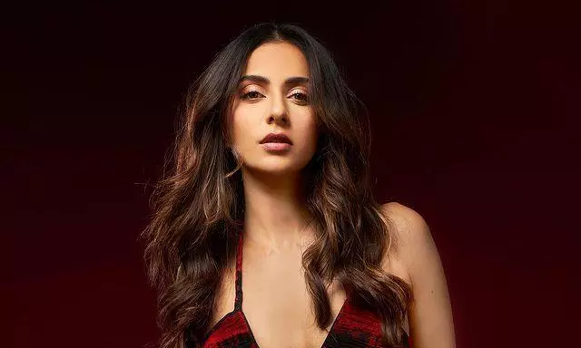 Mesmerising Look Of Rakul In Low Neck Cut Red Outfit!