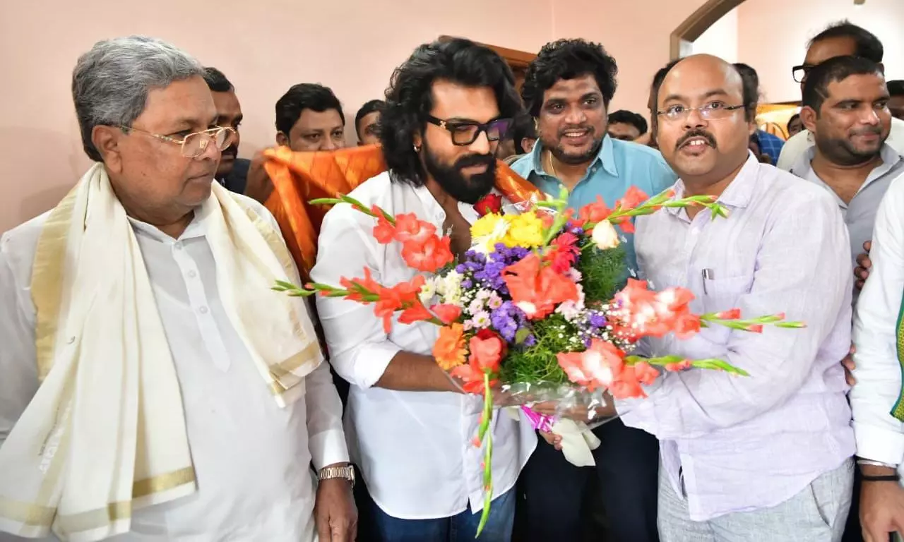 Karnataka CM Siddaramaiah felicitates Ram Charan