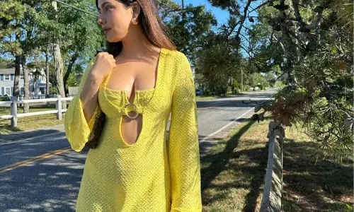 Stellar Clicks Of Neha Sharma In vibrant yellow cutout dress