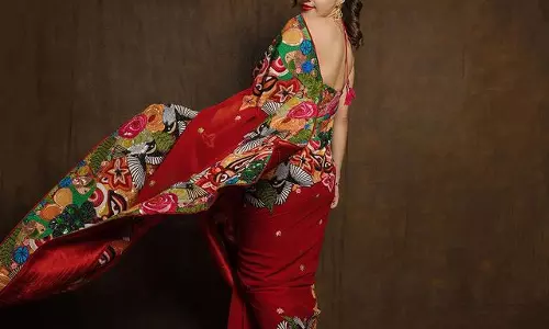 Mehreen Pirzada dazzles in a adorable red floral saree