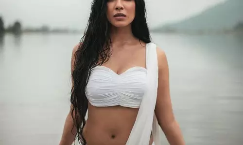 Magical Poses Of Malavika In Simple White & Water!