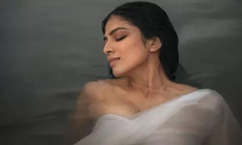 Magical Poses Of Malavika In Simple White & Water!