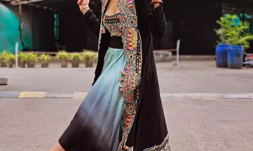 Mehreen Pirzada dazzles in a adorable red floral saree