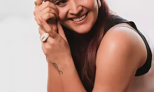 Anasuya Bharadwaj Poses in Floral-Infused Mini Dress