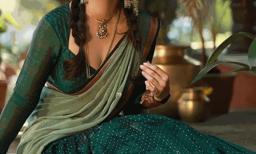 Malvika Sharmas Charm in Half Saree and Two Braids