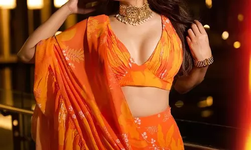 Shraddha Das Stunning Snaps in Orange Saree