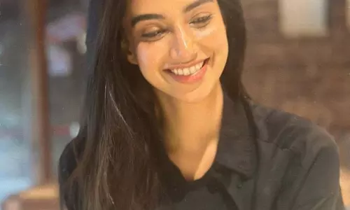 Meenakshi Chaudharys Beautiful Pictures in a Black Dress