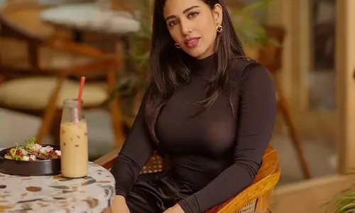 Daksha Nagarkar Sips and Strikes a Pose in Sultry Black Dress
