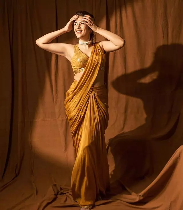 Shraddha Das Stunning Snaps in Orange Saree Shraddha Das Stunning Snaps in Orange Saree