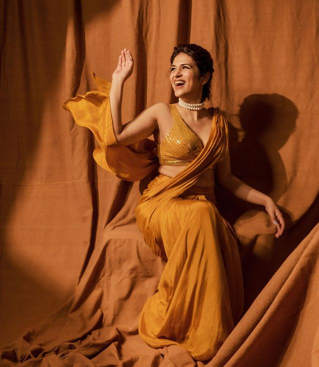 Shraddha Das Stunning Snaps in Orange Saree