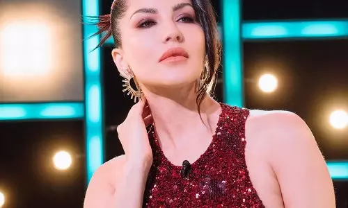 Sunny Leone Radiates in Maroon Cardigan Dress