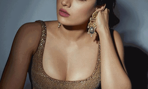 Rashmika Sizzles In Golden dress