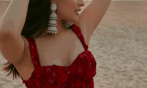Pragya Jaiswal Beach Elegance in Red Roses Dress