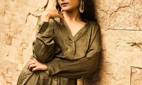 Chaitra Stuns in Brown Dress Hugs Curves Perfectly