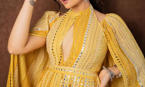 Sreemukhi Shines Bright in Dazzling Yellow Mirror Dress