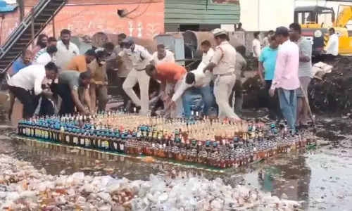 ప్రొక్లెయిన్ తో లిక్కర్ బాటిల్ పగలగొడుతున్న వేళ ప్రాణం పోయినంత పనైంది