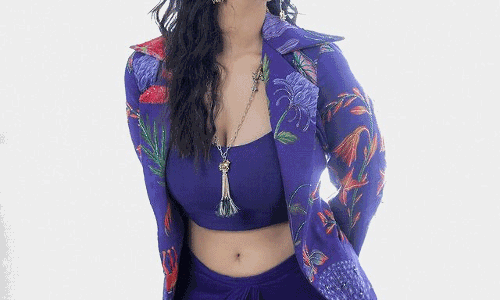 Meenakshis Stylish Flair in Violet