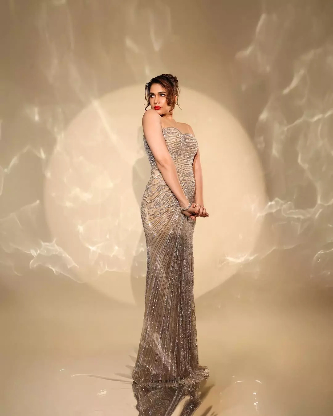 Lavanya Tripathi shines in a dazzling golden dress Lavanya Tripathi shines in a dazzling golden dress