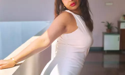 Inaya Sultana Poses Gracefully in a Stylish White Dress