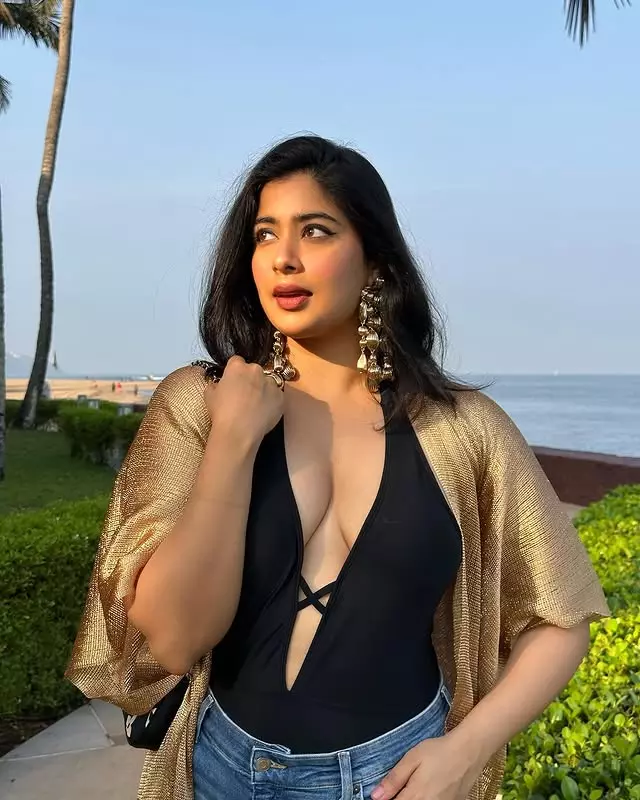 Nikita Sharma: Sleek Black Bodysuit with a Touch of Gold