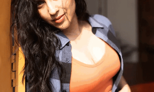 Komalee Prasad glows in orange crop top and checked shirt