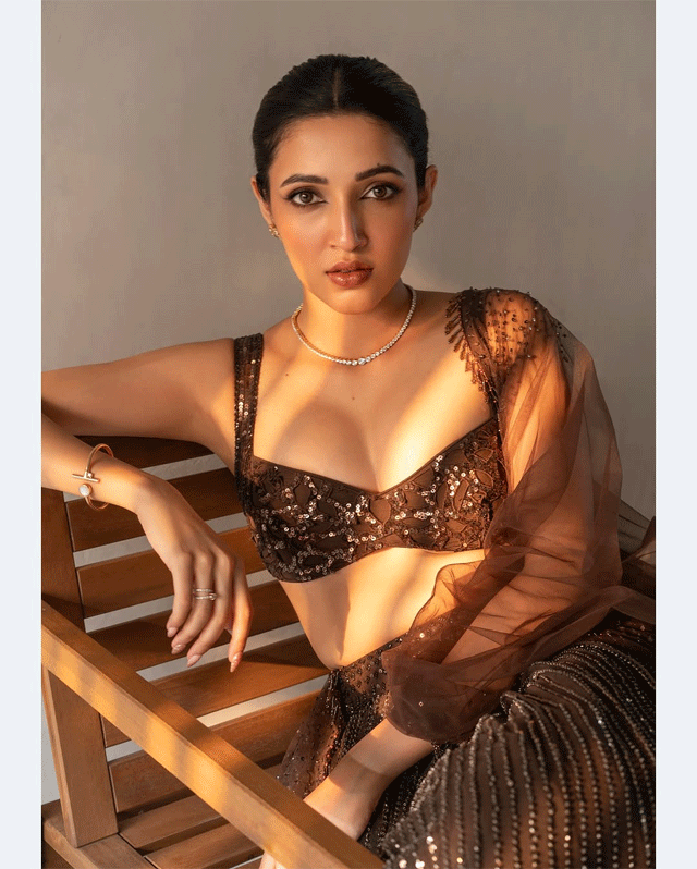 Neha Shetty Brings Caffeinated Couture with Bold Brown Charm Neha Shetty Brings Caffeinated Couture with Bold Brown Charm