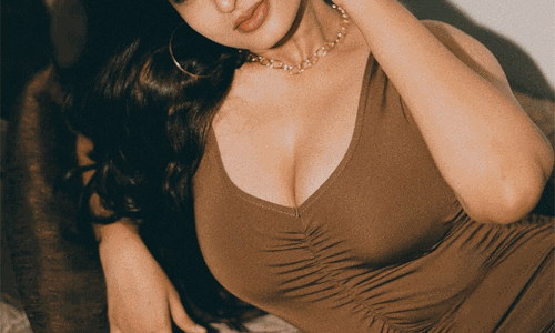 Ayesha turns up the heat in a fiery red shimmer gown