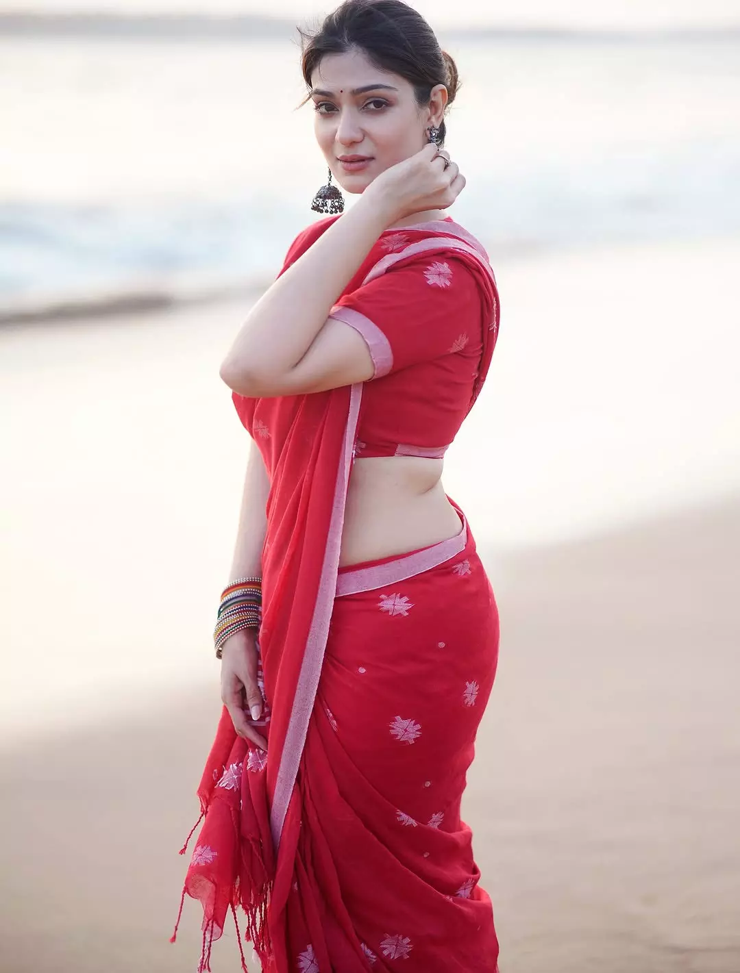 Aditi Gautam Glows in Red Saree on the Beach