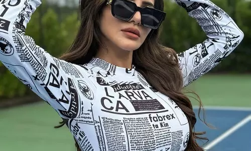 Ashu Reddy Turns Heads in Newspaper Print Dress on Tennis Court