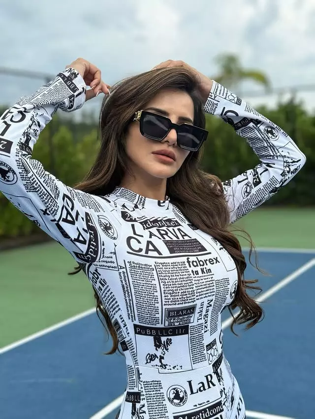 Ashu Reddy Turns Heads in Newspaper Print Dress on Tennis Court Ashu Reddy Turns Heads in Newspaper Print Dress on Tennis Court