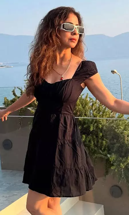 Urmila lights up the sunset in black beauty