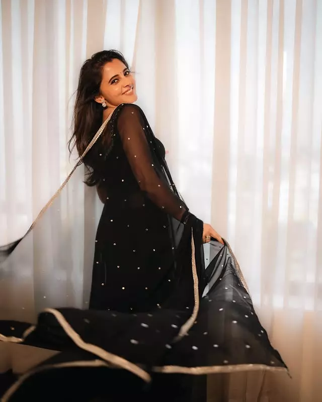 Preethi Asrani Stands by the Window in Black Suit Preethi Asrani Stands by the Window in Black Suit