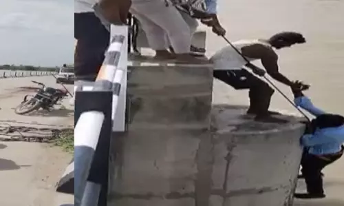 షాకింగ్  వీడియో... సెల్ఫీ అని నమ్మించి భర్తను కృష్ణా నదిలోకి తోసేసింది!