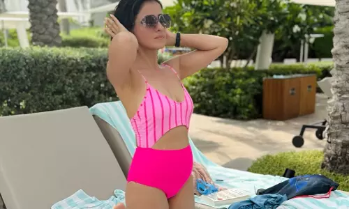 Manmadhudu Heroine Enjoys A Day Near the Pool in Pink