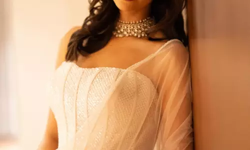 Meenakshi Chaudhary Looks Elegant in White Saree at GAMA Awards