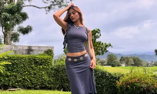 Saiee Manjrekar Shines in Gray Glamour Amidst Natures Backdrop