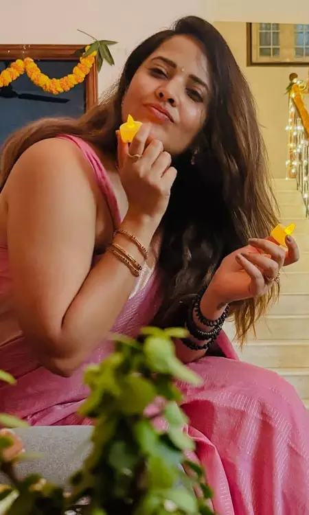 Anasuya Bharadwaj Embraces Festive Spirit in Graceful Pink Saree