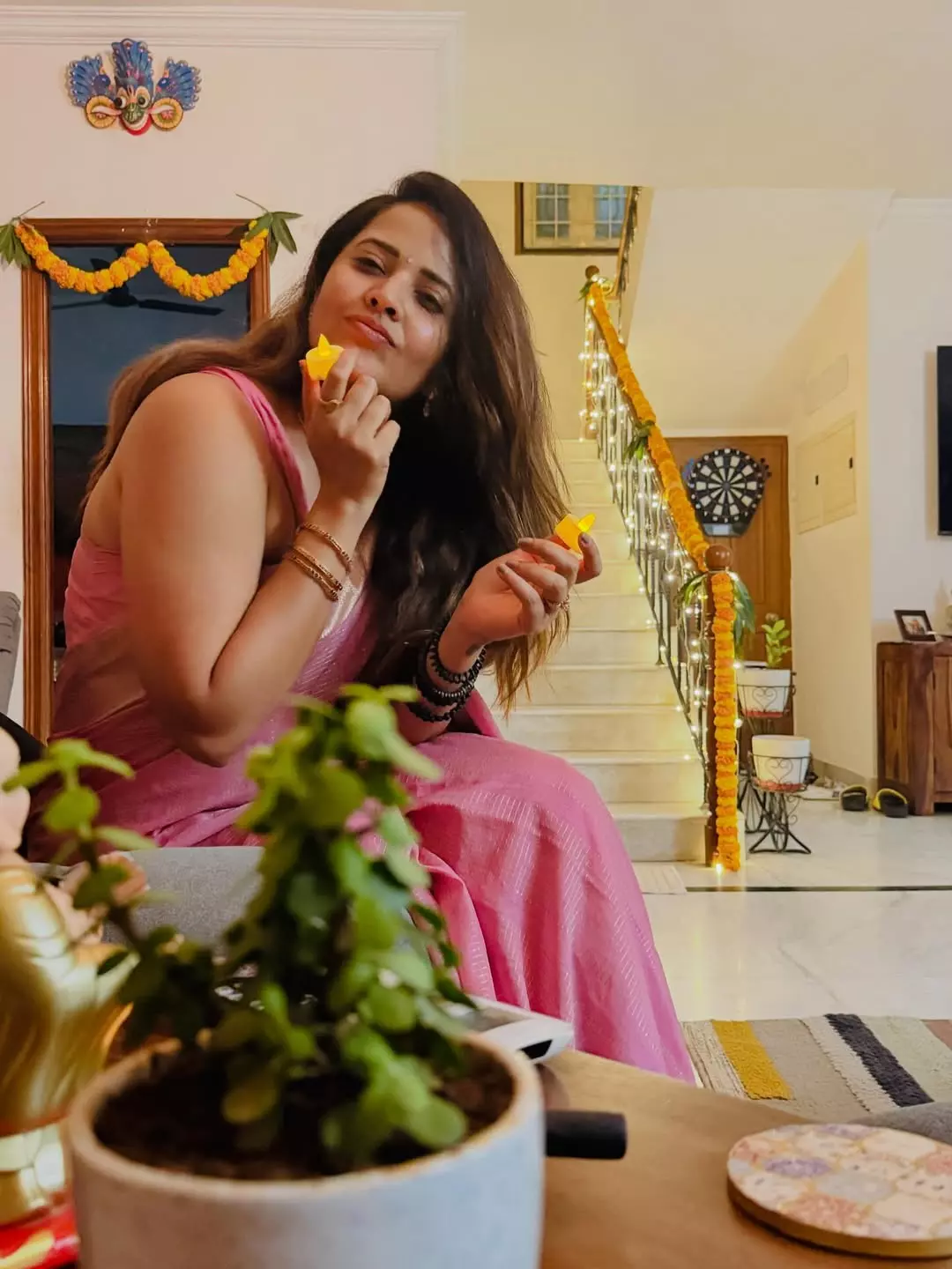 Anasuya Bharadwaj Embraces Festive Spirit in Graceful Pink Saree