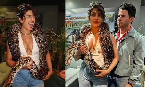 కొండ చిలువ‌ను ఆభ‌ర‌ణంలా ధ‌రించి పీసీ గ‌ట్స్