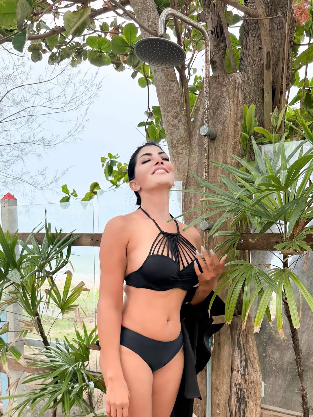 lahari shari stuns in black strappy bikini under waterfall
