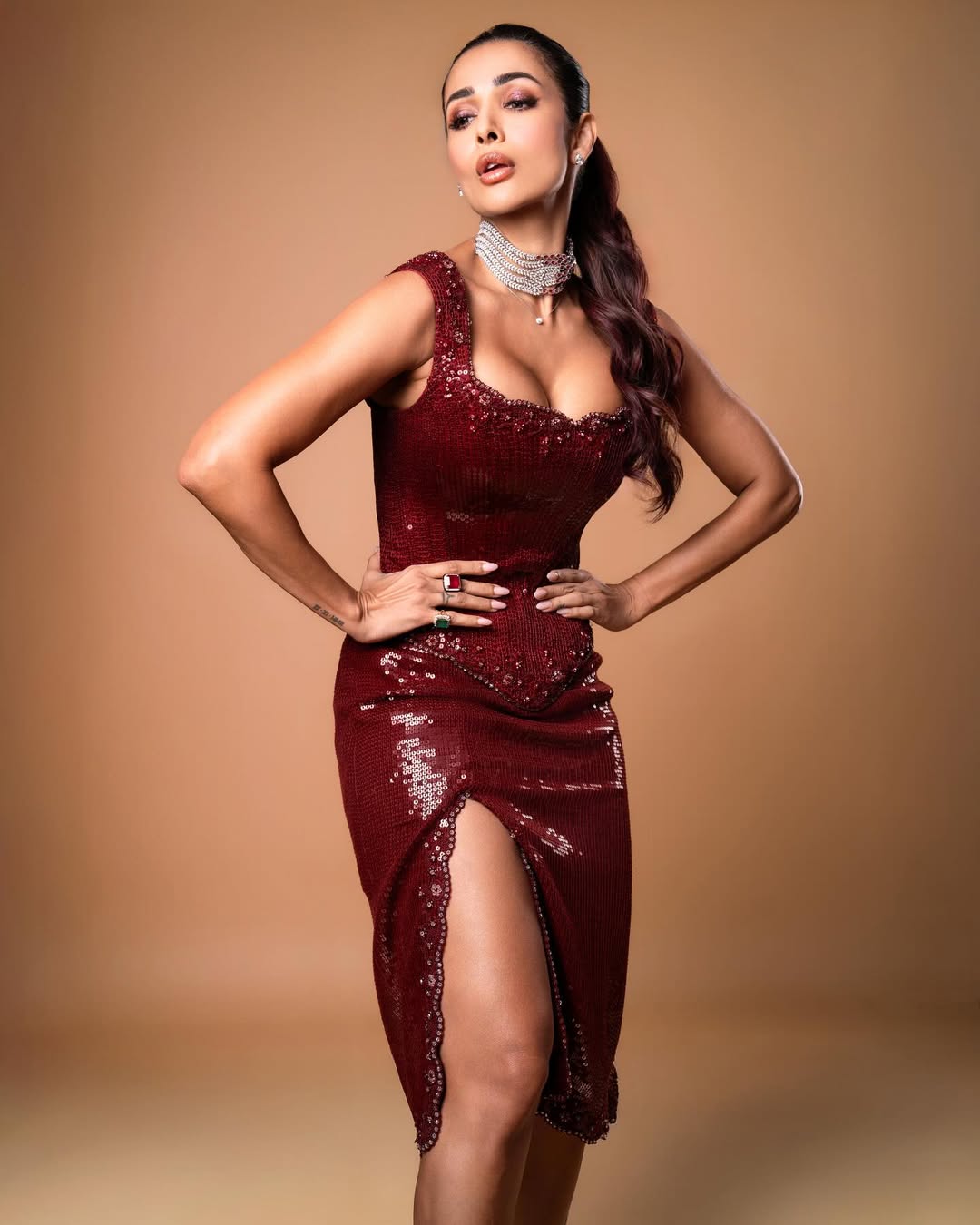 malaika arora sets the internet on fire in sequined wine gown