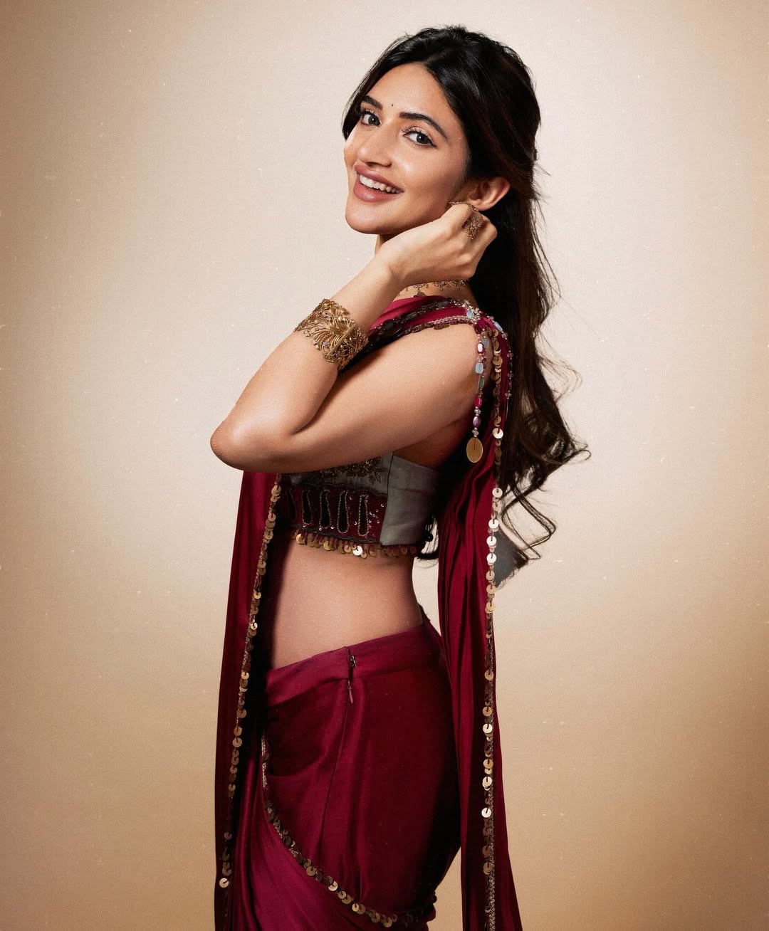 the royal mint effect: sreeleela’s maroon saree turns pure gold