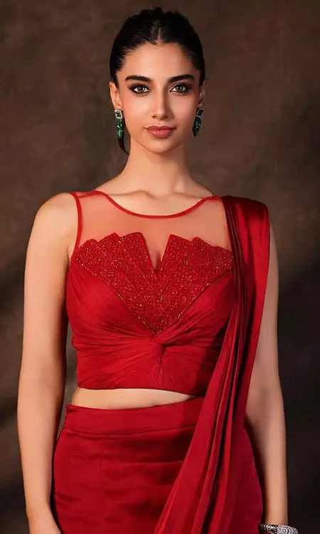 Meenakshi Chaudharys Red Hot Look Leaves Fans Spellbound