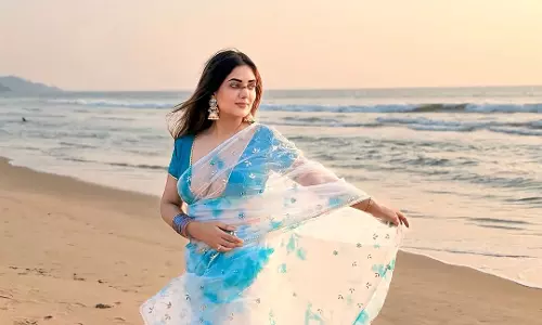 Natasha Singh Shines in Turquoise Saree by the Beach