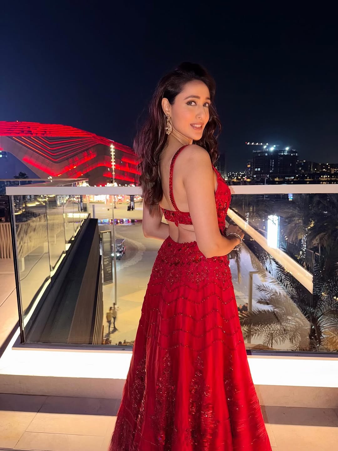 pragya jaiswal stuns in red gown against dubai skyline pragya jaiswal stuns in red gown against dubai skyline