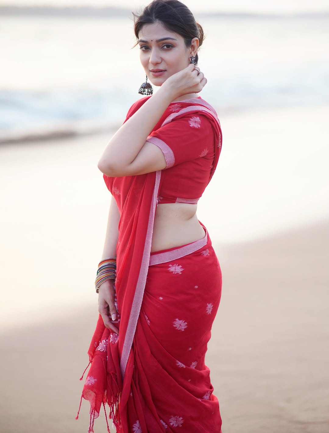 Aditi Gautam Stuns in Coral-Red Saree