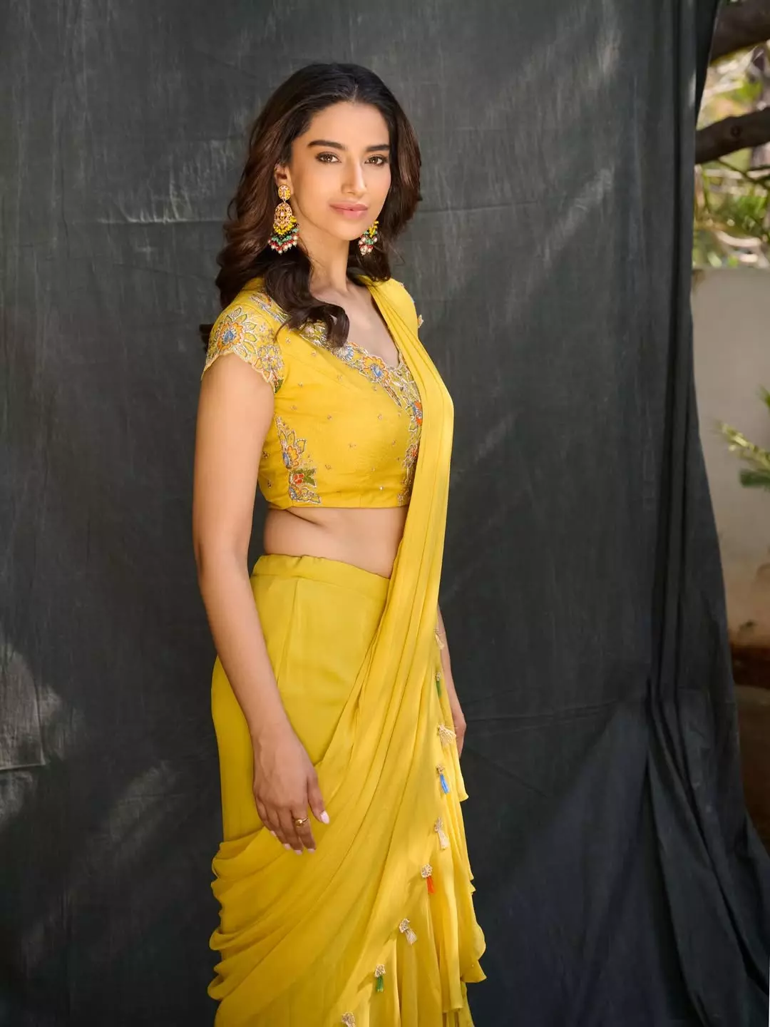Meenakshi Chaudhary Glows in Yellow Saree at ‘Bheemavaram Balma’ Song Launch