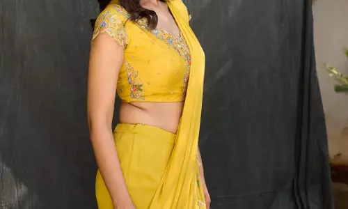 Meenakshi Chaudhary Glows in Yellow Saree at ‘Bheemavaram Balma’ Song Launch