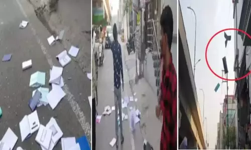 గాల్లో పుస్తకాలు.. ఎక్కడి నుంచి వస్తు్న్నాయని ఆశ్చర్యపోయిన వాహనదారులు