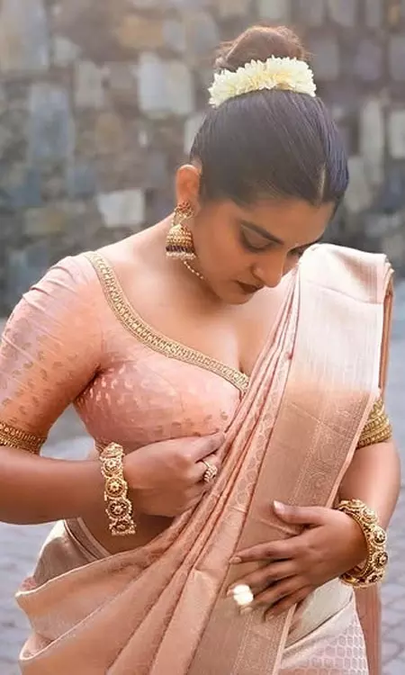 Nivetha Thomas Stuns In Classic Pink Peach Saree